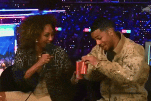 Man And Woman Toasting With Cans Of Coke GIF