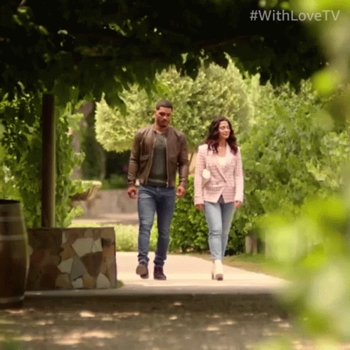 A Man And A Woman Are Walking Down A Path With The Hashtag #Withlovetv On The Bottom GIF