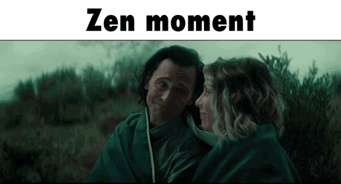 A Man And A Woman Are Wrapped In A Blanket And The Words Zen Moment Are Above Them GIF