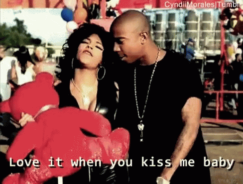 A Man And A Woman Holding A Teddy Bear With The Words Love It When You Kiss Me Baby Written Below Them GIF