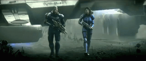 A Man And A Woman Holding Guns In Front Of A Ship That Says " M44 " GIF