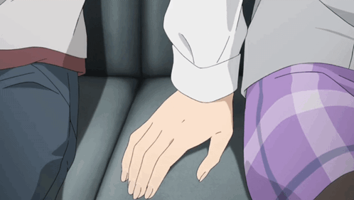 A Man And A Woman Holding Hands In A Car GIF