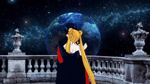 A Man And A Woman Hugging In Front Of A Statue Of The Earth GIF