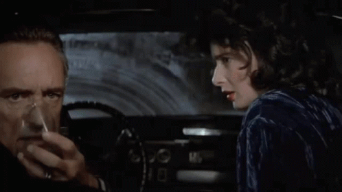 A Man And A Woman In A Car With The Words " Stay Alive Baby " Above Them GIF