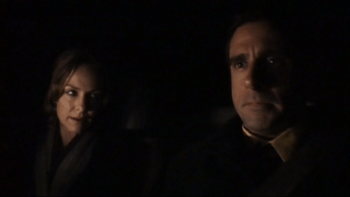 A Man And A Woman In A Dark Room With The Words I Feel Like It But I Am Not Going To Below Them GIF