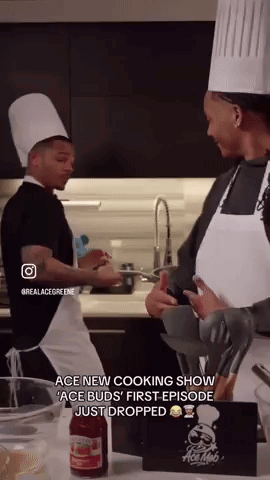 A Man And A Woman In Chef Hats Are Cooking In A Kitchen .. GIF