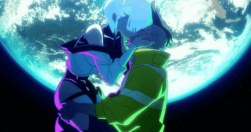 A Man And A Woman Kissing In Front Of A Blue Planet GIF