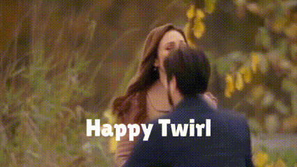 A Man And A Woman Kissing With The Words Happy Twirl Written On The Bottom GIF