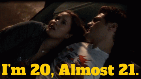A Man And A Woman Laying In A Car With The Words " I 'M 20 Almost 21 " GIF