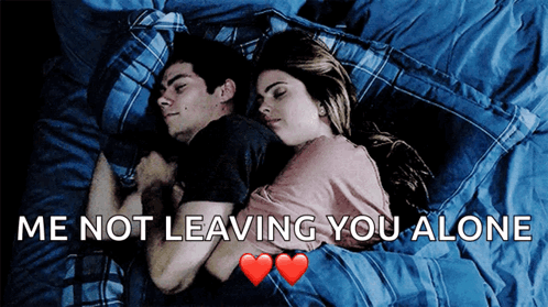 A Man And A Woman Laying In Bed With The Words Me Not Leaving You Alone GIF
