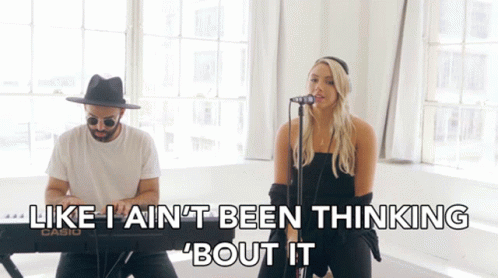 A Man And A Woman Singing In Front Of A Keyboard That Says Casio GIF