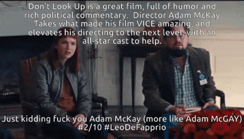 A Man And A Woman Sit Next To Each Other With A Caption That Says " Don T Look Up " GIF