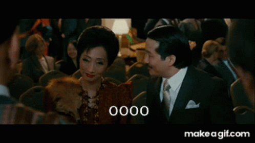 Man And Woman Sitting With 0000 On Screen GIF