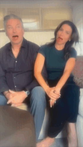 Man And Woman Sitting Together Woman Sticking Tongue GIF