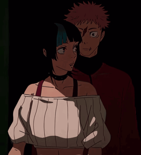 A Man And A Woman Standing Next To Each Other GIF