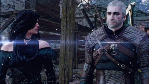 A Man And A Woman Standing Next To Each Other GIF