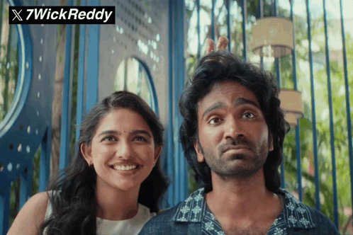 A Man And A Woman Standing Next To Each Other With 7Wick Reddy Written On The Top GIF