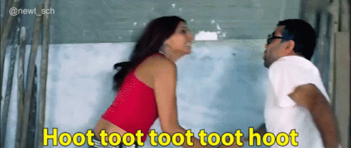 A Man And A Woman Standing Next To Each Other With A Caption That Says Hoot Toot Toot Toot Toot GIF