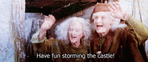 A Man And A Woman Standing Next To Each Other With The Words Have Fun Storming The Castle Written Below Them GIF