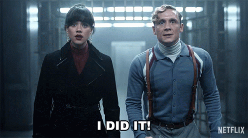 A Man And A Woman Standing Next To Each Other With The Words I Did It Written On The Screen GIF