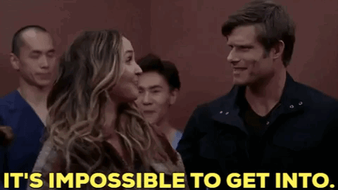 Man And Woman Standing Next To Each Other Saying It's Impossible To Get In GIF