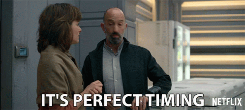 a man and a woman standing next to each other with the words it 's perfect timing netflix