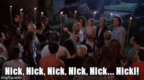 A Man And A Woman Standing Next To Each Other With The Words Nick Nick Nick Nick Nick Nick Written On The Screen GIF