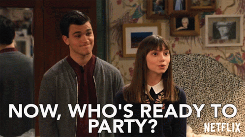 A Man And A Woman Standing Next To Each Other With The Words Now Who 'S Ready To Party On The Bottom GIF