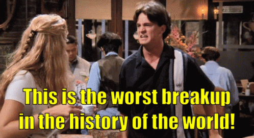 A Man And A Woman Standing Next To Each Other With The Words " This Is The Worst Breakup In The History Of The World " GIF