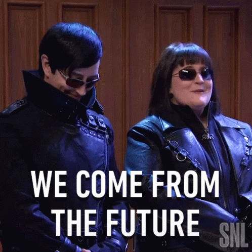 A Man And A Woman Standing Next To Each Other With The Words We Come From The Future GIF