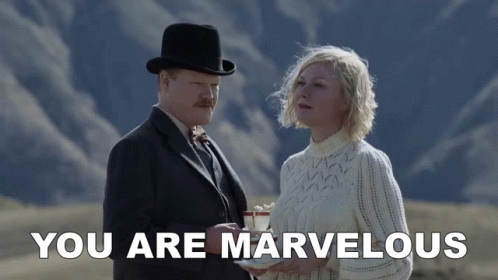A Man And A Woman Standing Next To Each Other With The Words " You Are Marvelous " Below Them GIF