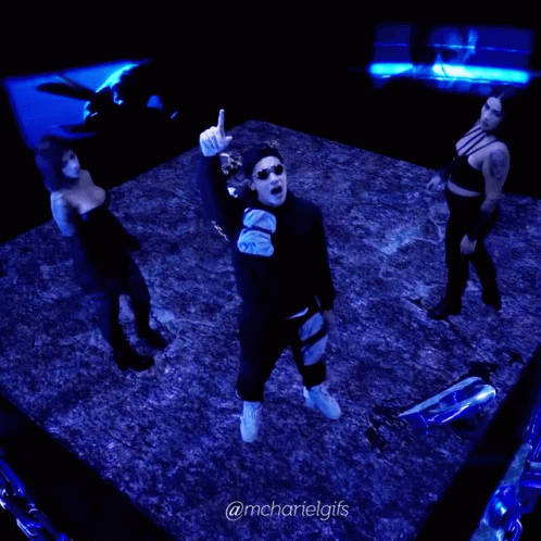 A Man And Two Women Are Dancing In A Dark Room With The Hashtag @Mchartelgifs On The Bottom GIF