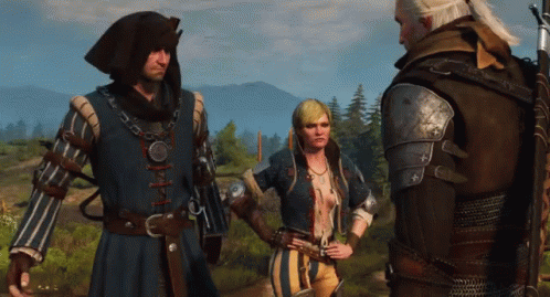 A Man And Two Women Are Standing In A Field And Talking To Each Other GIF