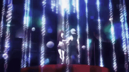 A Man And Woman Are Dancing In A Dark Room GIF
