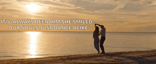 A Man And Woman Are Dancing On The Beach With A Quote That Says It 'S Always Been Him She Smiled GIF