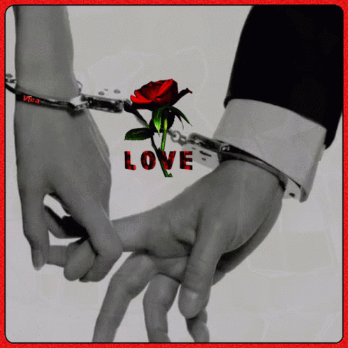 A Man And Woman Are Handcuffed Together And The Word Love Is On The Bottom Right GIF