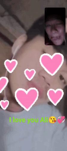 A Man And Woman Are Having A Video Call And The Words I Love You Ali Are On The Screen GIF