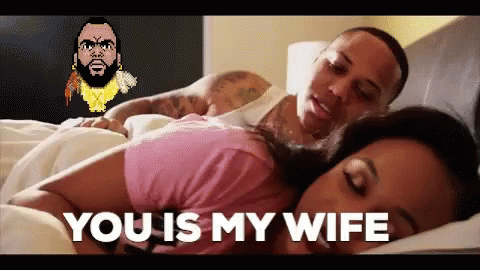 A Man And Woman Are Laying In Bed And The Woman Is Saying You Is My Wife . GIF