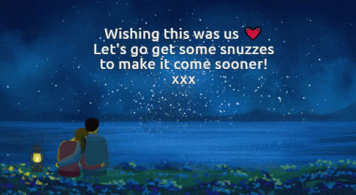 A Man And Woman Are Sitting In Front Of A Body Of Water With A Wishing Message GIF