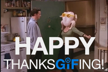 A Man And Woman Are Standing In A Kitchen With The Words Happy Thanksgiving In The Corner GIF
