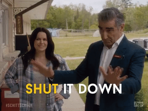 A Man And Woman Are Standing Next To Each Other And The Man Is Saying Shut It Down . GIF