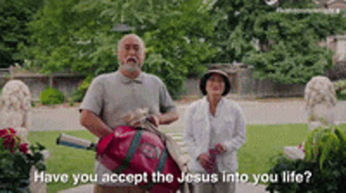 A Man And Woman Are Standing Next To Each Other In A Park And The Man Is Holding A Golf Bag . GIF
