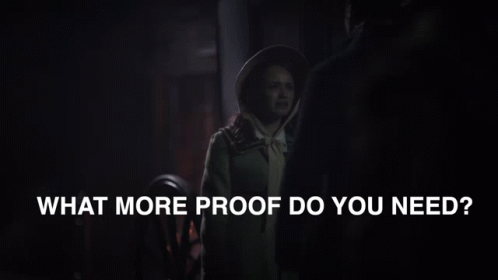 A Man And Woman Are Standing Next To Each Other With The Words What More Proof Do You Need Below Them GIF