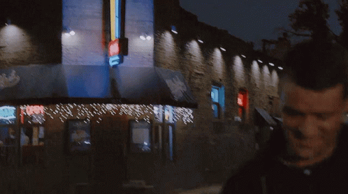A Man And Woman Are Walking Down A Street And The Man Says I 'M Sorry To Take You Away GIF