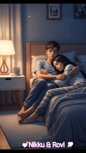 A Man And Woman Hugging On A Bed With The Name Nikki & Rovi On The Bottom Right GIF