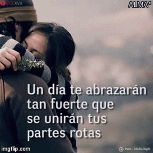 A Man And Woman Hugging With A Quote In Spanish On The Bottom GIF