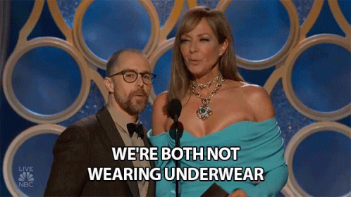 A Man And Woman On A Stage With The Words We 'Re Both Not Wearing Underwear Behind Them GIF