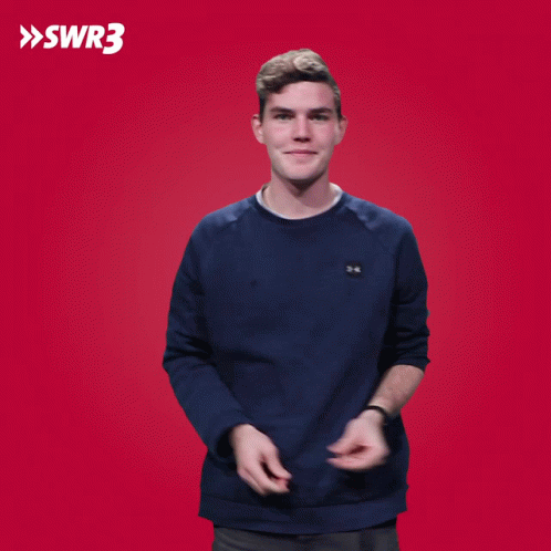 A Man Applauds In Front Of A Red Background That Says Swr3 On It GIF