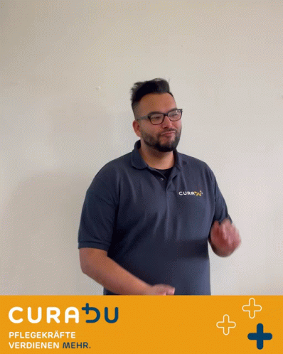 A Man Applauds In Front Of A Sign That Says Curadu Pflegekrafte Verdienen Mehr GIF