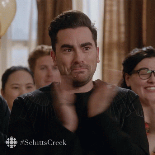 A Man Applauds With A #Schitts Creek Watermark GIF